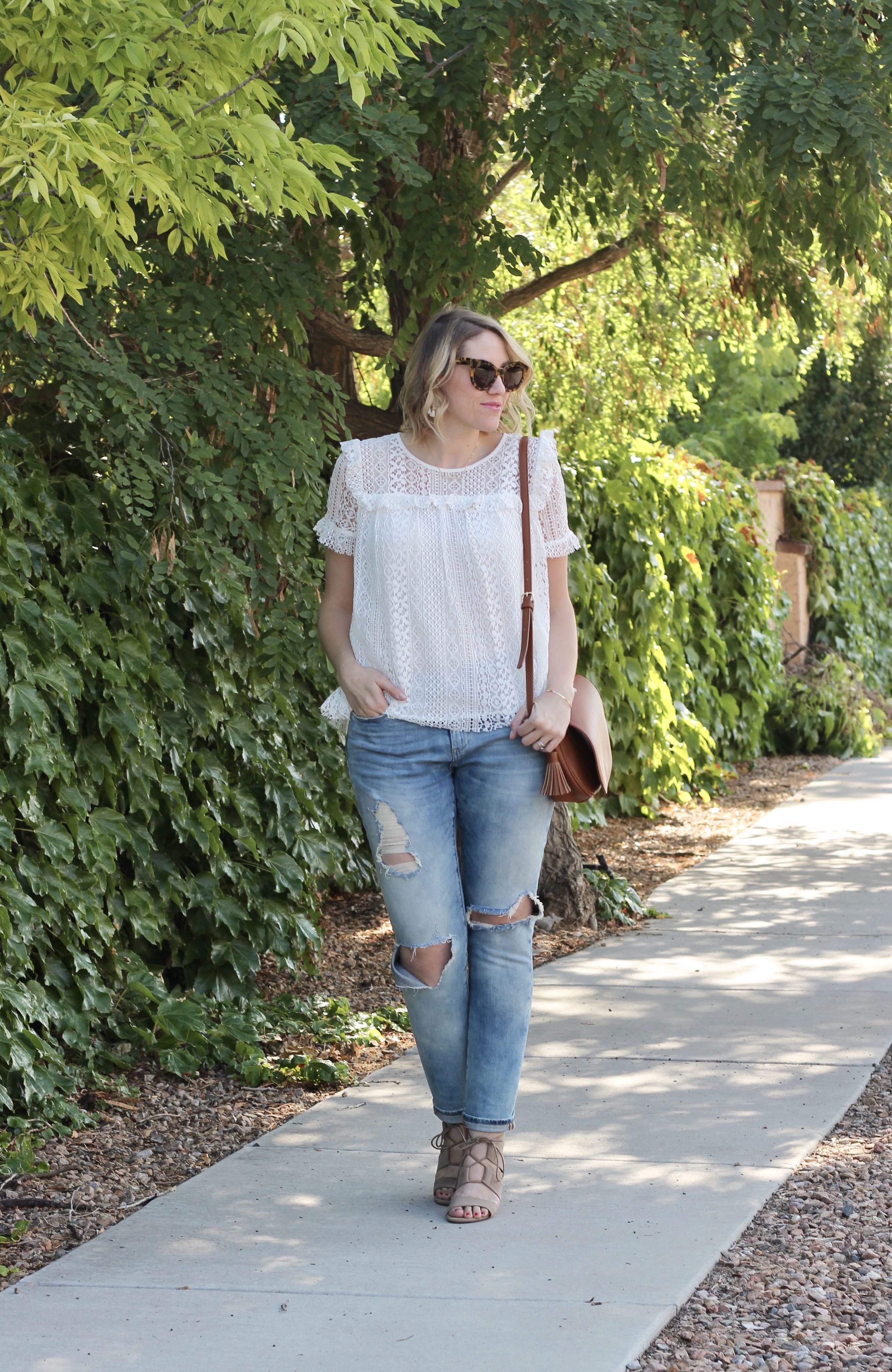 distressed jeans and a lace top