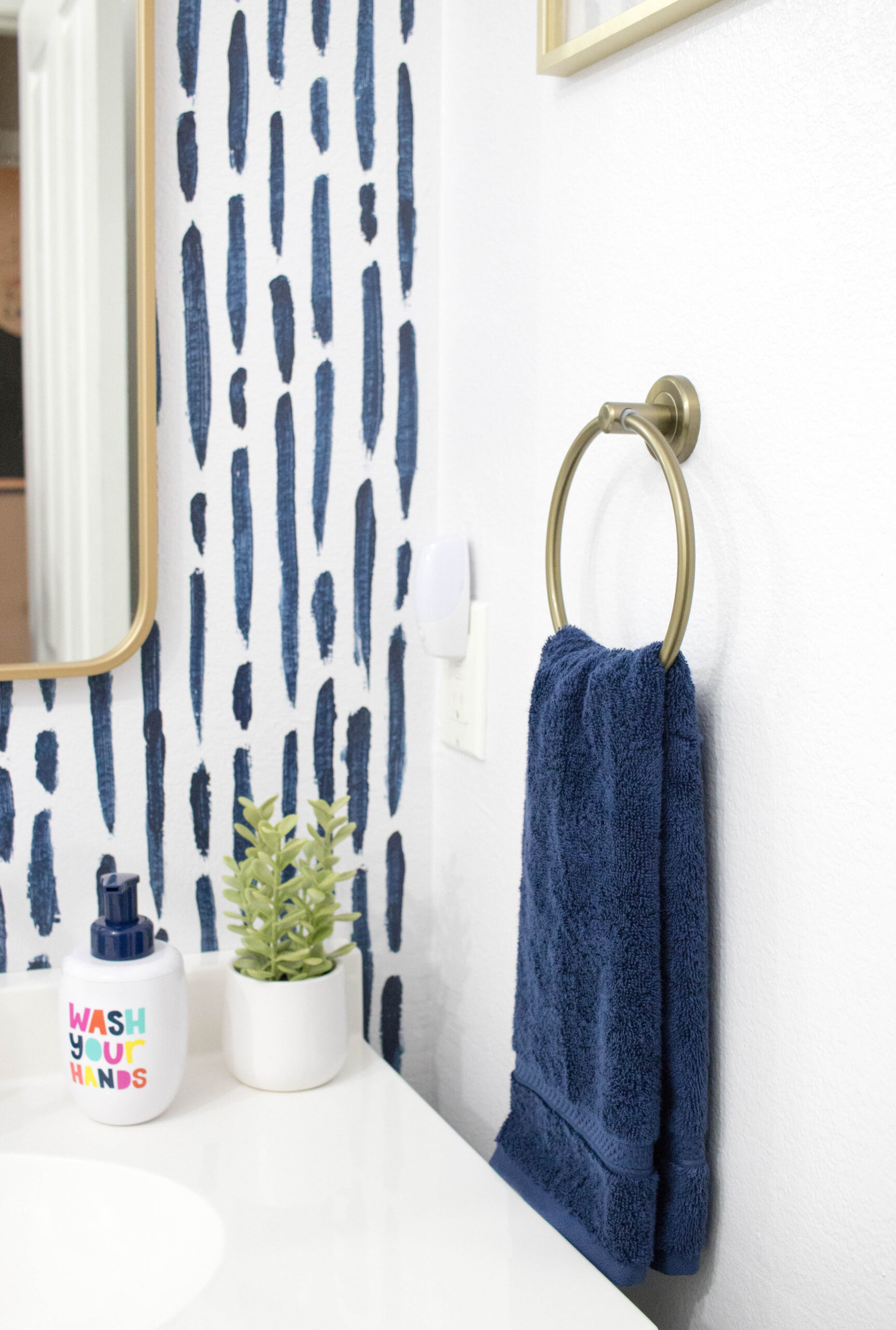 gold and navy bathroom decor #bathroomdecor #bathroomrefresh #diyaccentwall