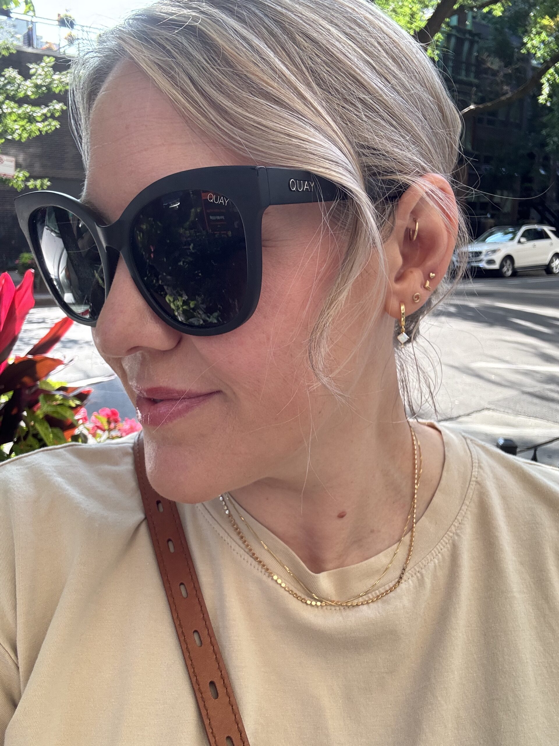 delicate gold jewelry; multiple ear piercings, curated earrings